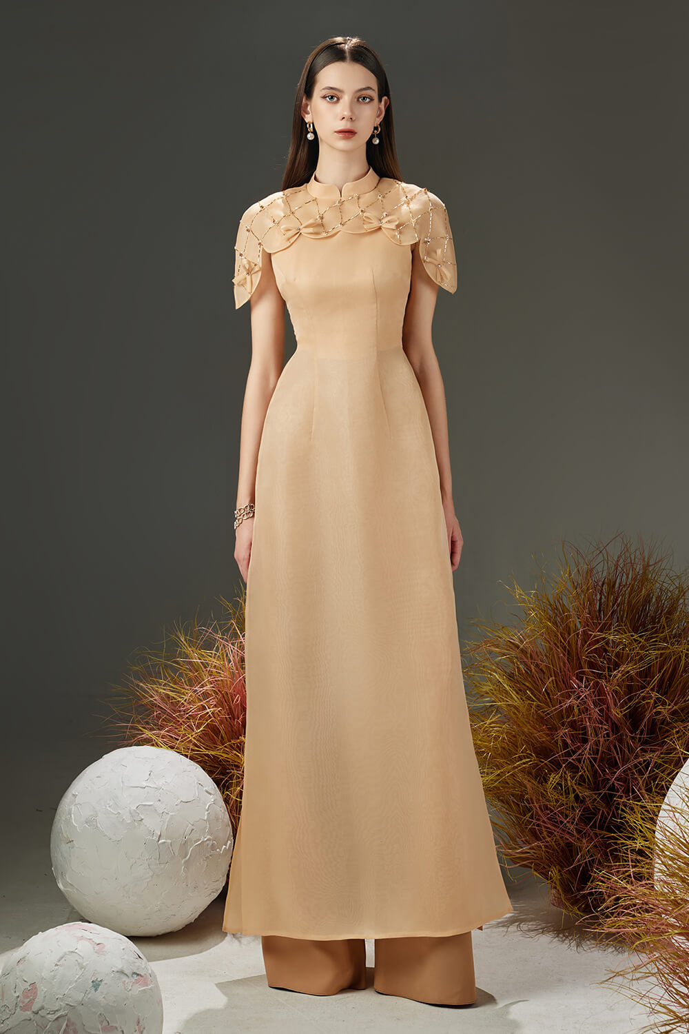 Modyis Champagne Cape Sleeve Ao Dai Gown with Pearl Embellished Collar