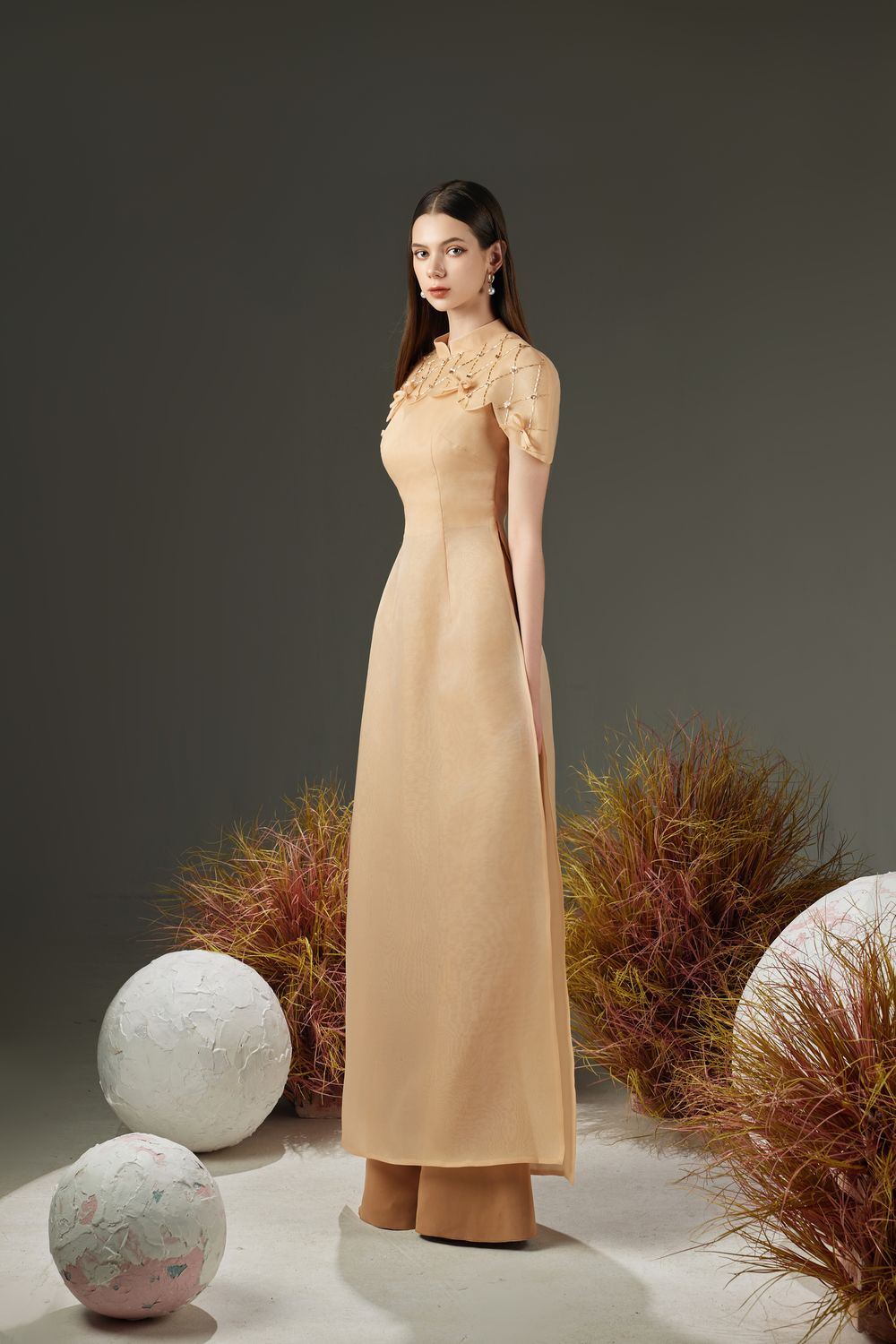 Modyis Champagne Cape Sleeve Ao Dai Gown with Pearl Embellished Collar